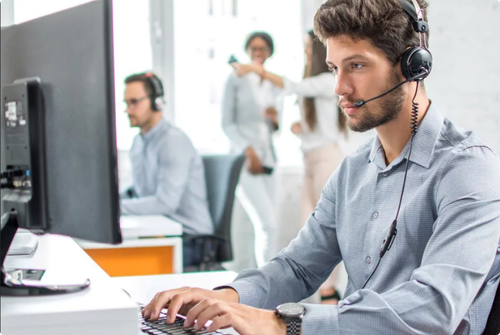 IT technician working remotely on a laptop